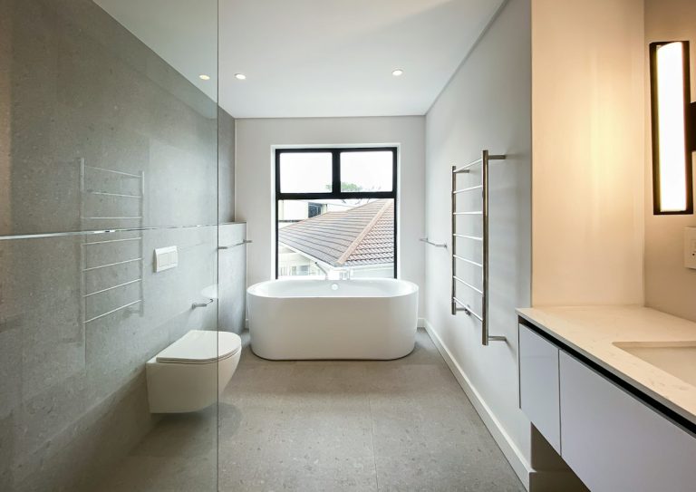 Bathroom with soaking tub under a window
