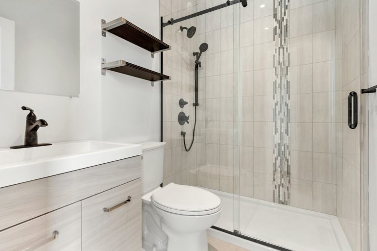 Tiled shower in a former tub alcove style layout